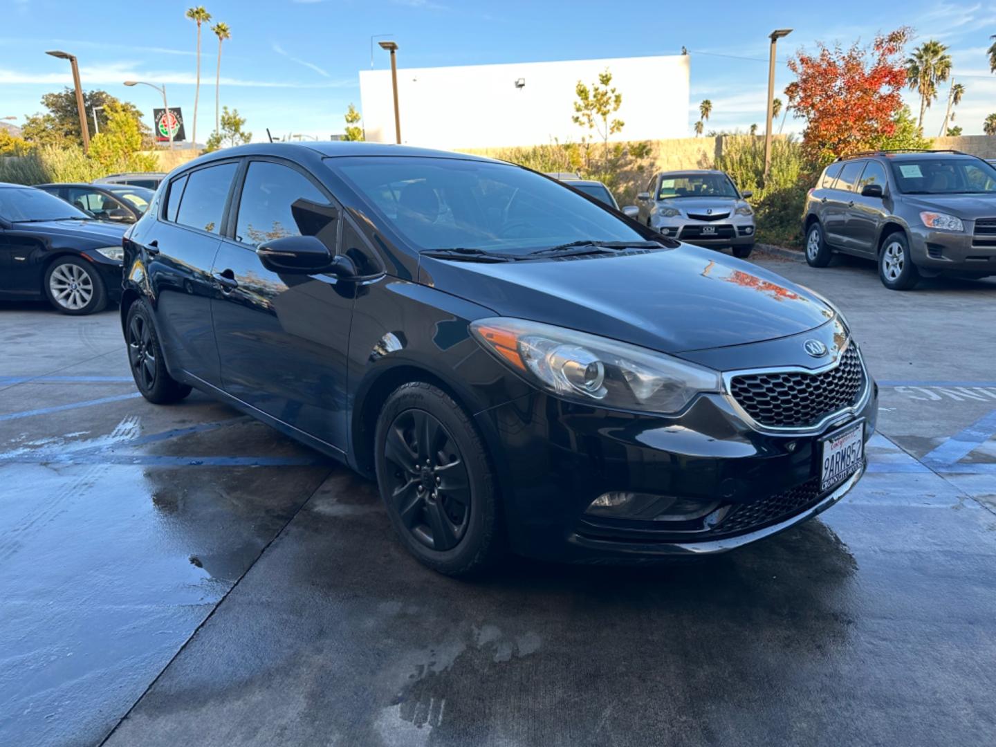 2016 Black /Black Kia Forte 5-Door Cloth (KNAFK5A87G5) with an 4 CYLINDER engine, Automatic transmission, located at 30 S. Berkeley Avenue, Pasadena, CA, 91107, (626) 248-7567, 34.145447, -118.109398 - Embark on a Journey of Style and Efficiency with the 2016 Kia Forte Hatch - Now Available at Our Premier Pasadena, CA Dealership Welcome to our BHPH dealership in Pasadena, CA, where we proudly present the 2016 Kia Forte Hatch, a vehicle that seamlessly blends stylish design, modern technology, a - Photo#6